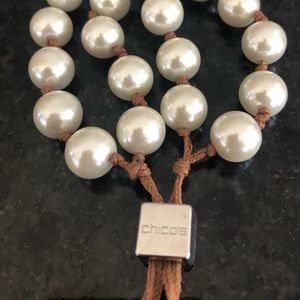 Chico’s adjustable pearl and leather tassel bracelet.